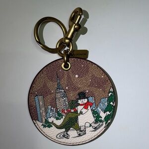 Coach Winter Wonderland Bag Charm In Signature Canvas With Rexy And Snowman